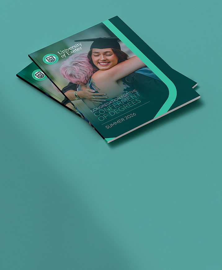 A stack of beautiful university of Exeter graduation brochures.